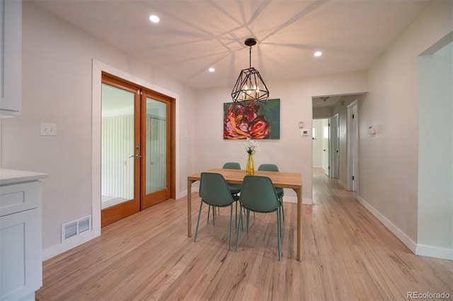 4425 E Harvard Ave, Denver, CO 80222 - dining room with light wood finished floors, recessed lighting, baseboards, and french doors