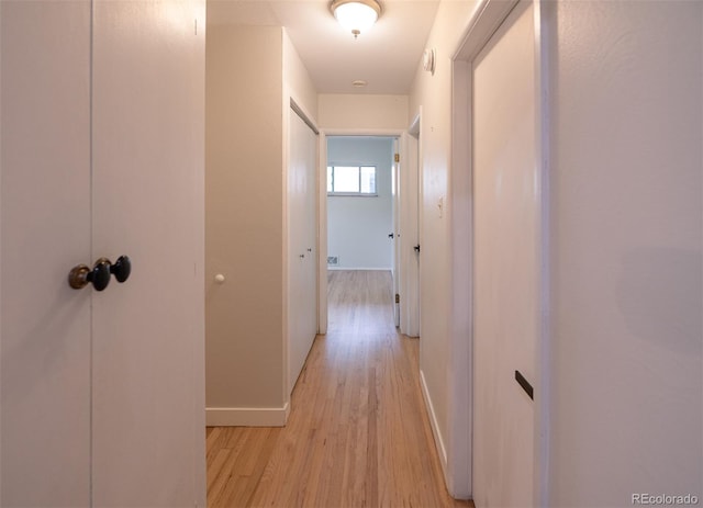 4425 E Harvard Ave, Denver, CO 80222 - hallway featuring light wood-style flooring and baseboards
