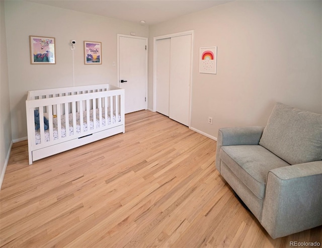 4425 E Harvard Ave, Denver, CO 80222 - bedroom with light wood-style flooring, baseboards, and a closet