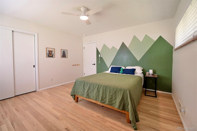 4425 E Harvard Ave, Denver, CO 80222 - bedroom featuring light wood finished floors, baseboards, a ceiling fan, and a closet