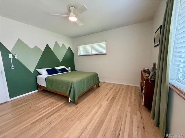 4425 E Harvard Ave, Denver, CO 80222 - bedroom with light wood-style flooring, multiple windows, baseboards, and ceiling fan