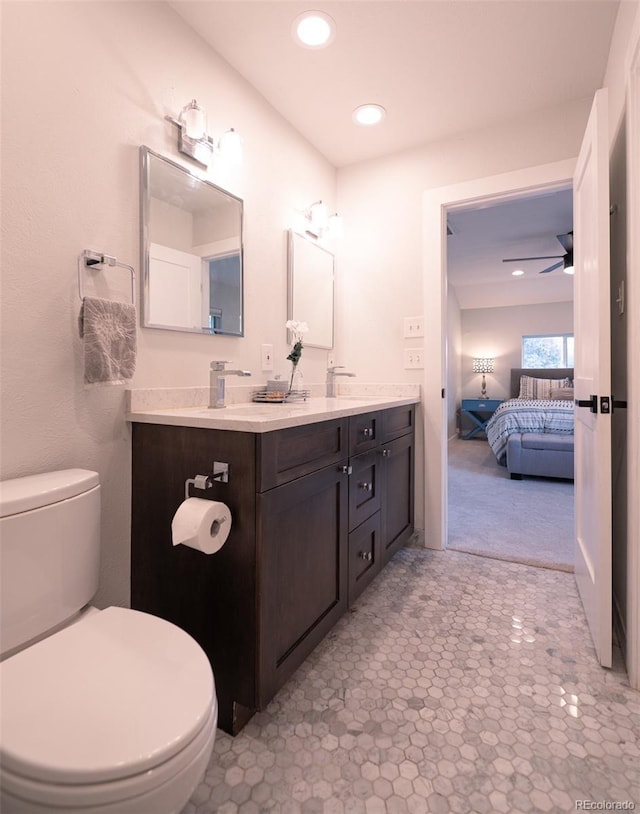 4425 E Harvard Ave, Denver, CO 80222 - full bath with toilet, connected bathroom, double vanity, recessed lighting, and ceiling fan