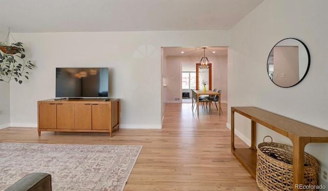 4425 E Harvard Ave, Denver, CO 80222 - living area with light wood-style flooring and baseboards