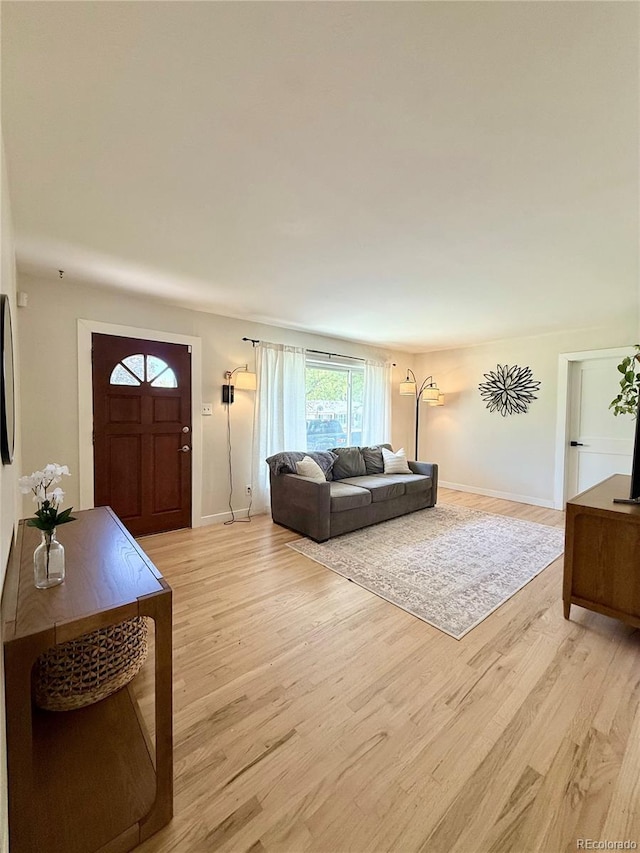 4425 E Harvard Ave, Denver, CO 80222 - living area with light wood-type flooring and baseboards