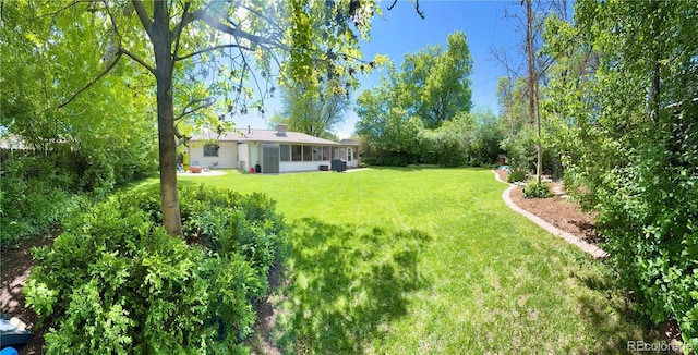 4425 E Harvard Ave, Denver, CO 80222 - view of grassy yard with a sunroom