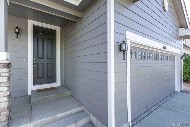 7686 Grady Cir, Castle Rock, CO 80108 - entrance to property featuring an attached garage and concrete driveway