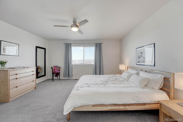 7686 Grady Cir, Castle Rock, CO 80108 - bedroom with light colored carpet, a ceiling fan, and baseboards