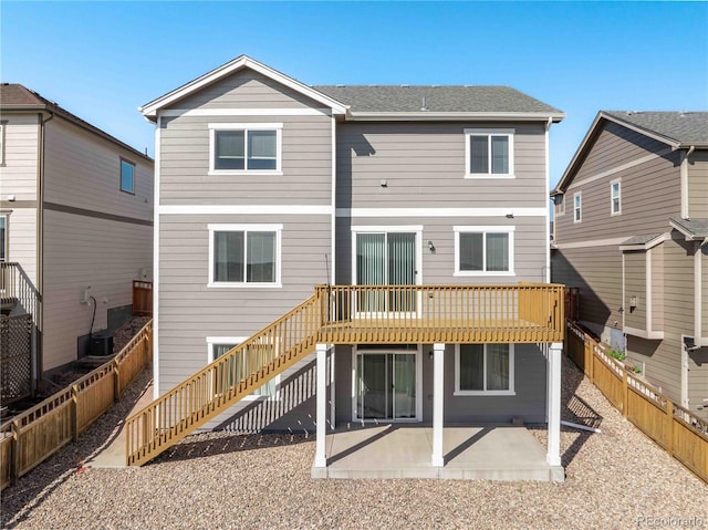7686 Grady Cir, Castle Rock, CO 80108 - rear view of house featuring stairway, a patio area, a fenced backyard, and a deck