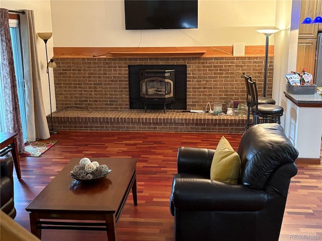 14963 E Adriatic Pl, Aurora, CO 80014 - living room with wood finished floors and a wood stove