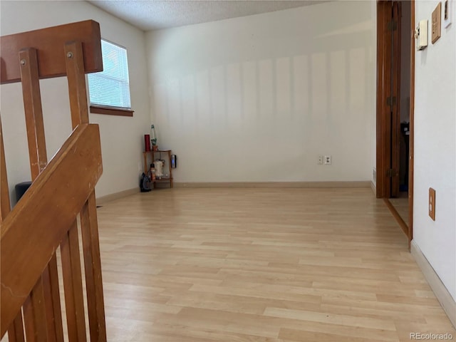 14963 E Adriatic Pl, Aurora, CO 80014 - unfurnished room featuring wood finished floors and a textured ceiling
