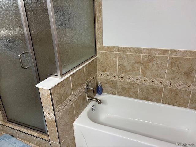 14963 E Adriatic Pl, Aurora, CO 80014 - bathroom with a stall shower, a bath, and tile walls