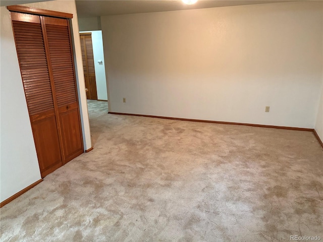 14963 E Adriatic Pl, Aurora, CO 80014 - unfurnished bedroom featuring light colored carpet and a closet
