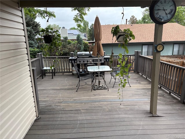 14963 E Adriatic Pl, Aurora, CO 80014 - wooden terrace with area for grilling and outdoor dining area