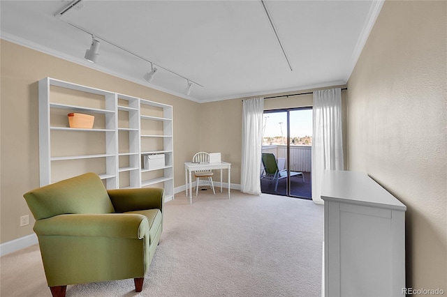 sitting room featuring crown molding and light carpet