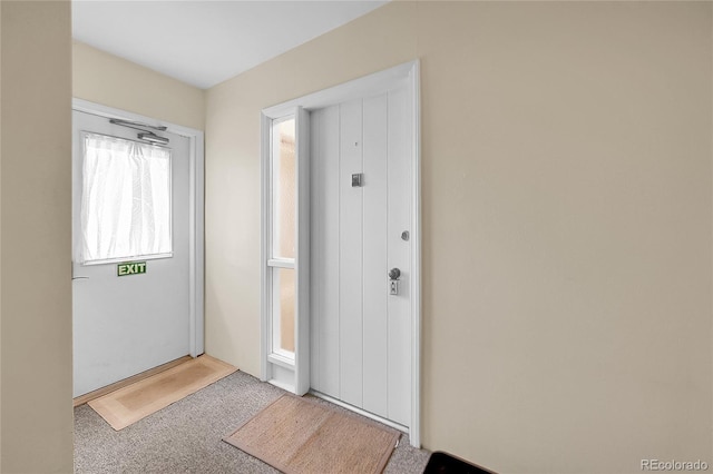 entryway featuring carpet floors