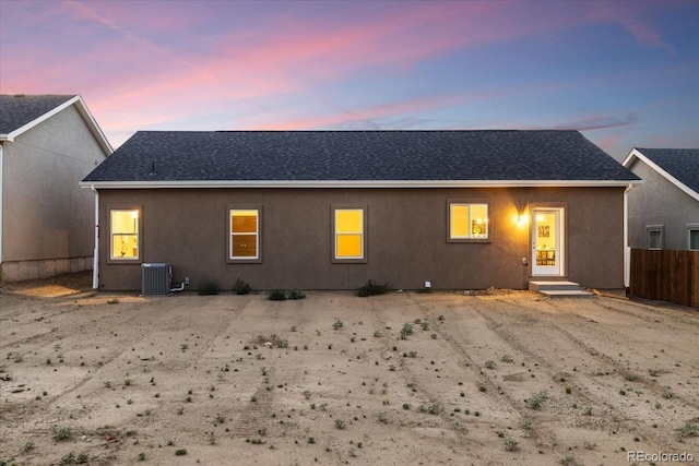 back house at dusk with central AC