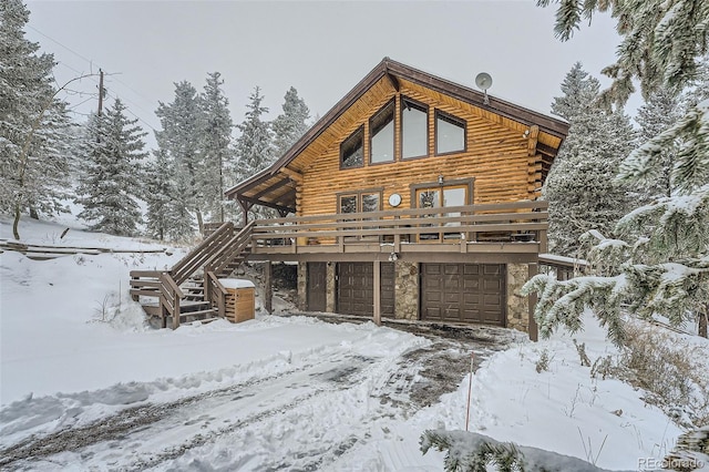 exterior space featuring a wooden deck and a garage