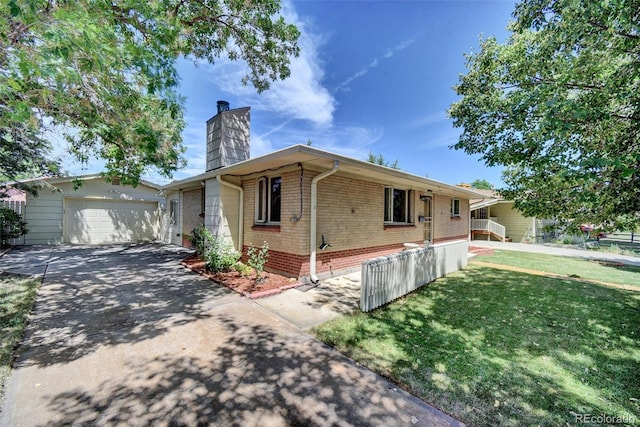 8841 Hunter Way, Westminster, CO 80031 - ranch-style home with brick siding, a chimney, a front yard, and driveway
