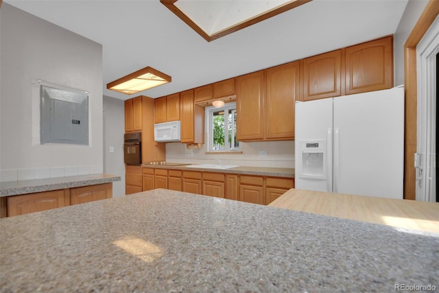 8841 Hunter Way, Westminster, CO 80031 - kitchen with black appliances, electric panel, and decorative backsplash