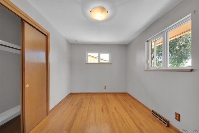 8841 Hunter Way, Westminster, CO 80031 - unfurnished bedroom with light wood-style floors and a closet