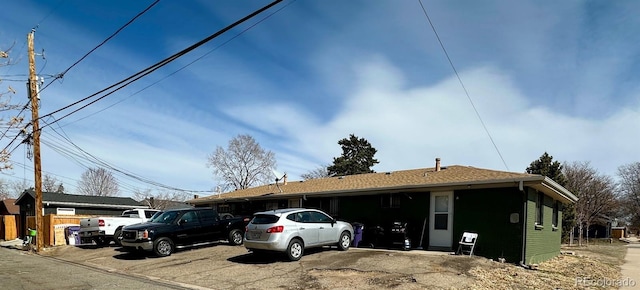 view of front of home featuring fence