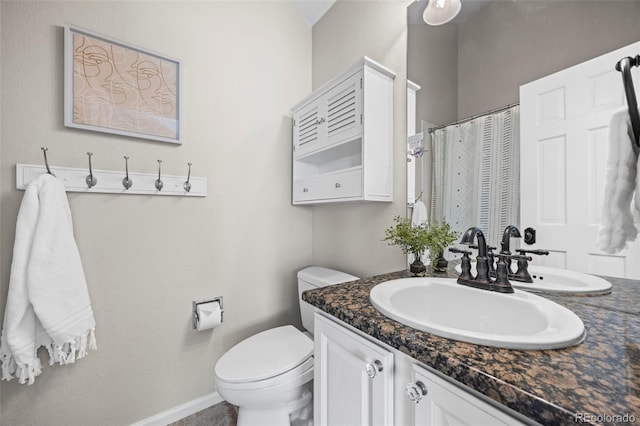 7067 Gray Fox Ct, Highlands Ranch, CO 80130 - bathroom with vanity, toilet, baseboards, and a shower with curtain