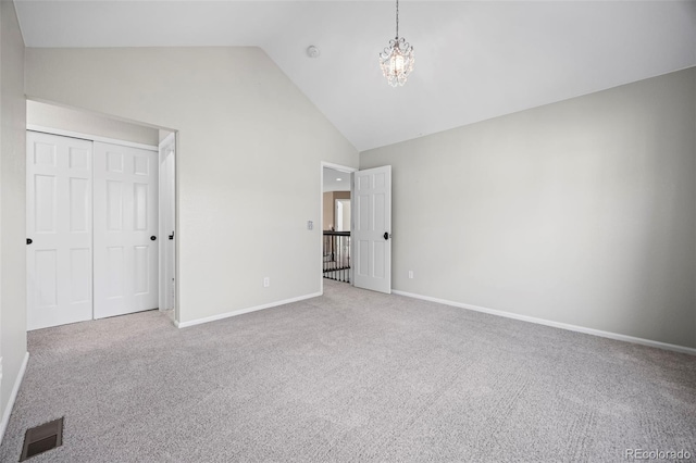 7067 Gray Fox Ct, Highlands Ranch, CO 80130 - unfurnished bedroom with carpet floors, high vaulted ceiling, baseboards, a chandelier, and a closet