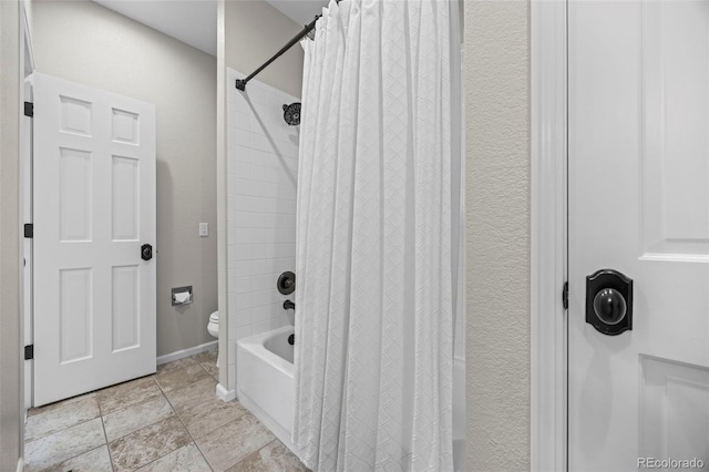 7067 Gray Fox Ct, Highlands Ranch, CO 80130 - full bath with shower / bathtub combination with curtain, toilet, and baseboards