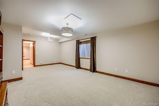 7067 Gray Fox Ct, Highlands Ranch, CO 80130 - spare room featuring light carpet, baseboards, and a textured ceiling