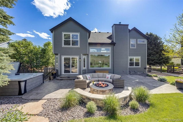 7067 Gray Fox Ct, Highlands Ranch, CO 80130 - back of house featuring a patio, a chimney, and an outdoor living space with a fire pit