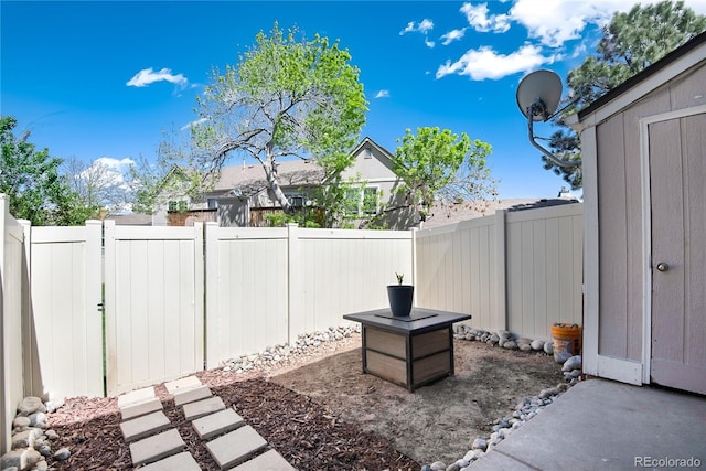 9713 W Chatfield Ave Unit F, Littleton, CO 80128 - fenced backyard featuring a gate