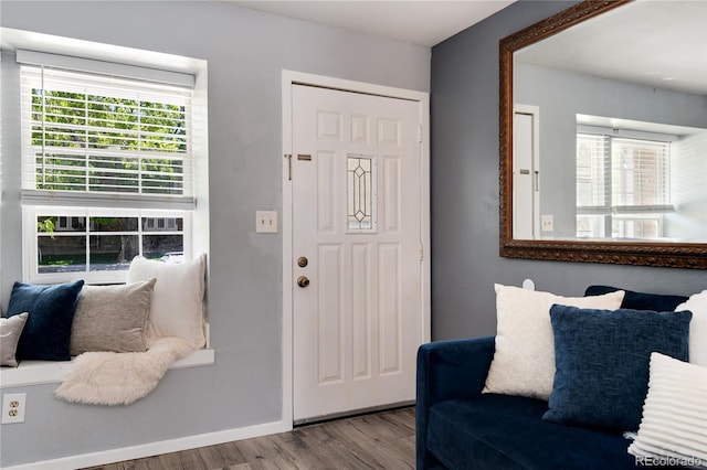 9713 W Chatfield Ave Unit F, Littleton, CO 80128 - foyer entrance with wood finished floors and baseboards