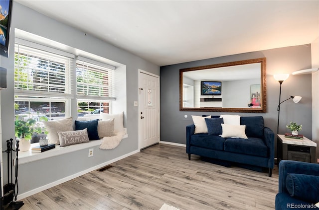 9713 W Chatfield Ave Unit F, Littleton, CO 80128 - living room with wood finished floors and baseboards