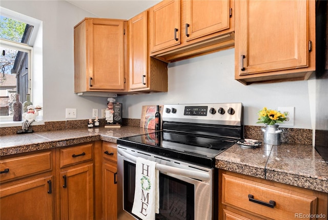 9713 W Chatfield Ave Unit F, Littleton, CO 80128 - kitchen featuring stainless steel electric range oven and tile counters
