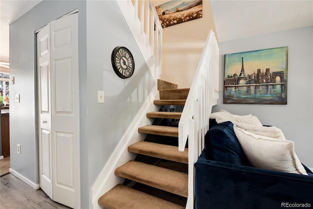9713 W Chatfield Ave Unit F, Littleton, CO 80128 - stairway with wood finished floors and baseboards