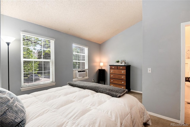 9713 W Chatfield Ave Unit F, Littleton, CO 80128 - carpeted bedroom with a textured ceiling, baseboards, lofted ceiling, and cooling unit