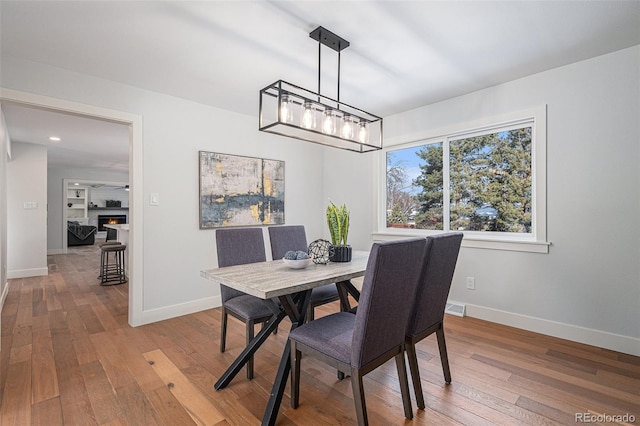 dining area featuring hardwood / wood-style floors