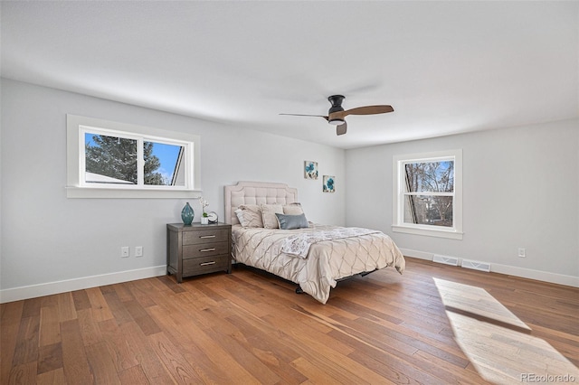 bedroom featuring light wood-type flooring and ceiling fan