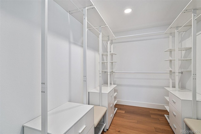 spacious closet with light hardwood / wood-style floors