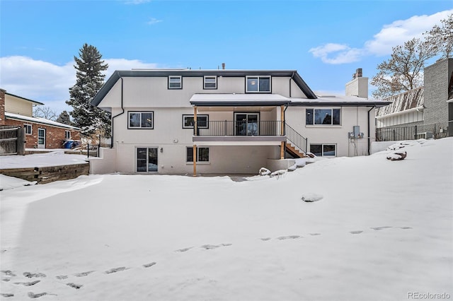 view of snow covered house