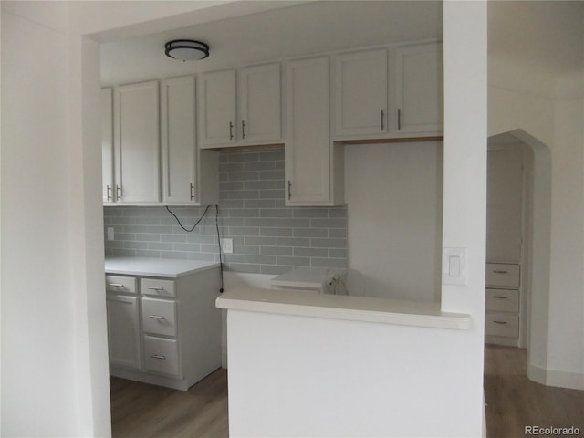 3243 Albion St, Denver, CO 80207 - kitchen with light wood finished floors, tasteful backsplash, and light countertops