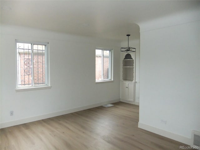 3243 Albion St, Denver, CO 80207 - unfurnished dining area featuring wood finished floors and baseboards