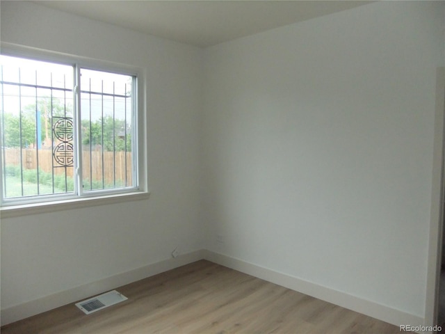 3243 Albion St, Denver, CO 80207 - spare room featuring light wood-style floors and baseboards