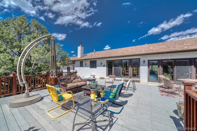 deck featuring an outdoor living space