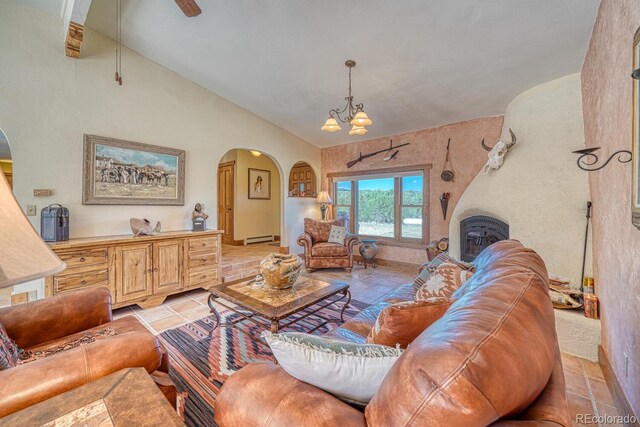 living room featuring a notable chandelier, vaulted ceiling with beams, light tile patterned flooring, and a baseboard heating unit