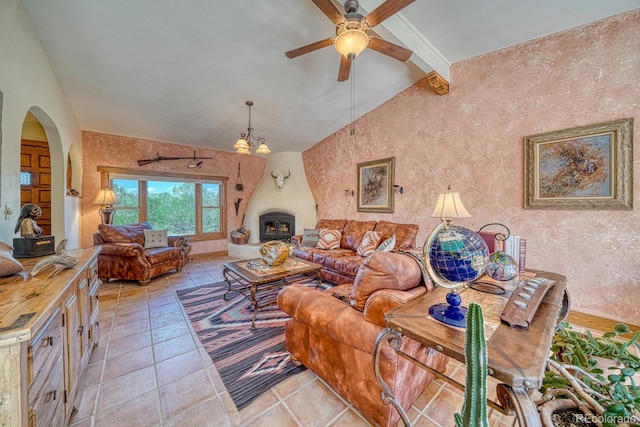 living room with vaulted ceiling with beams and ceiling fan with notable chandelier