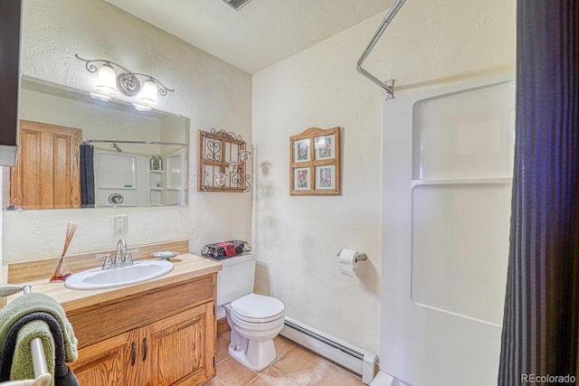 bathroom featuring vanity, a shower, tile patterned flooring, toilet, and baseboard heating