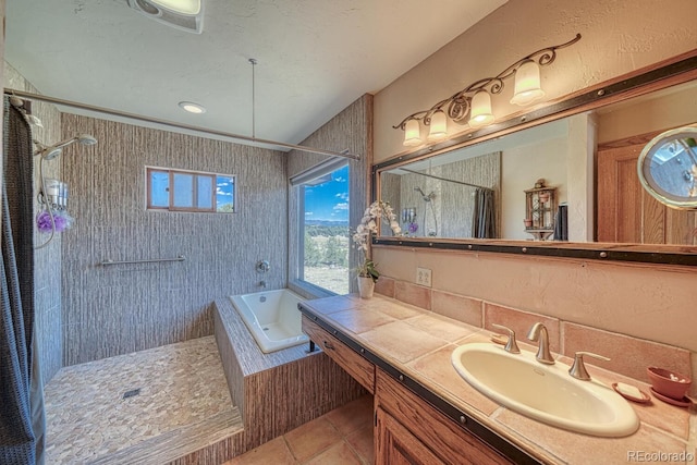 bathroom featuring tile patterned flooring, vanity, and plus walk in shower