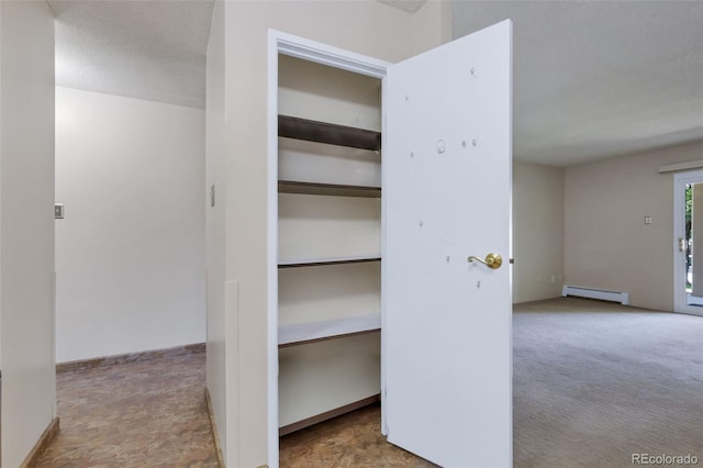 13606 E Bates Ave Unit 102, Aurora, CO 80014 - closet with a baseboard radiator