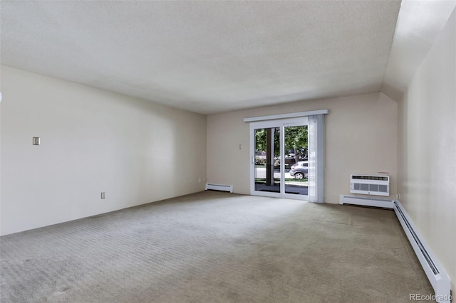 13606 E Bates Ave Unit 102, Aurora, CO 80014 - spare room with baseboard heating, an AC wall unit, carpet flooring, and a textured ceiling
